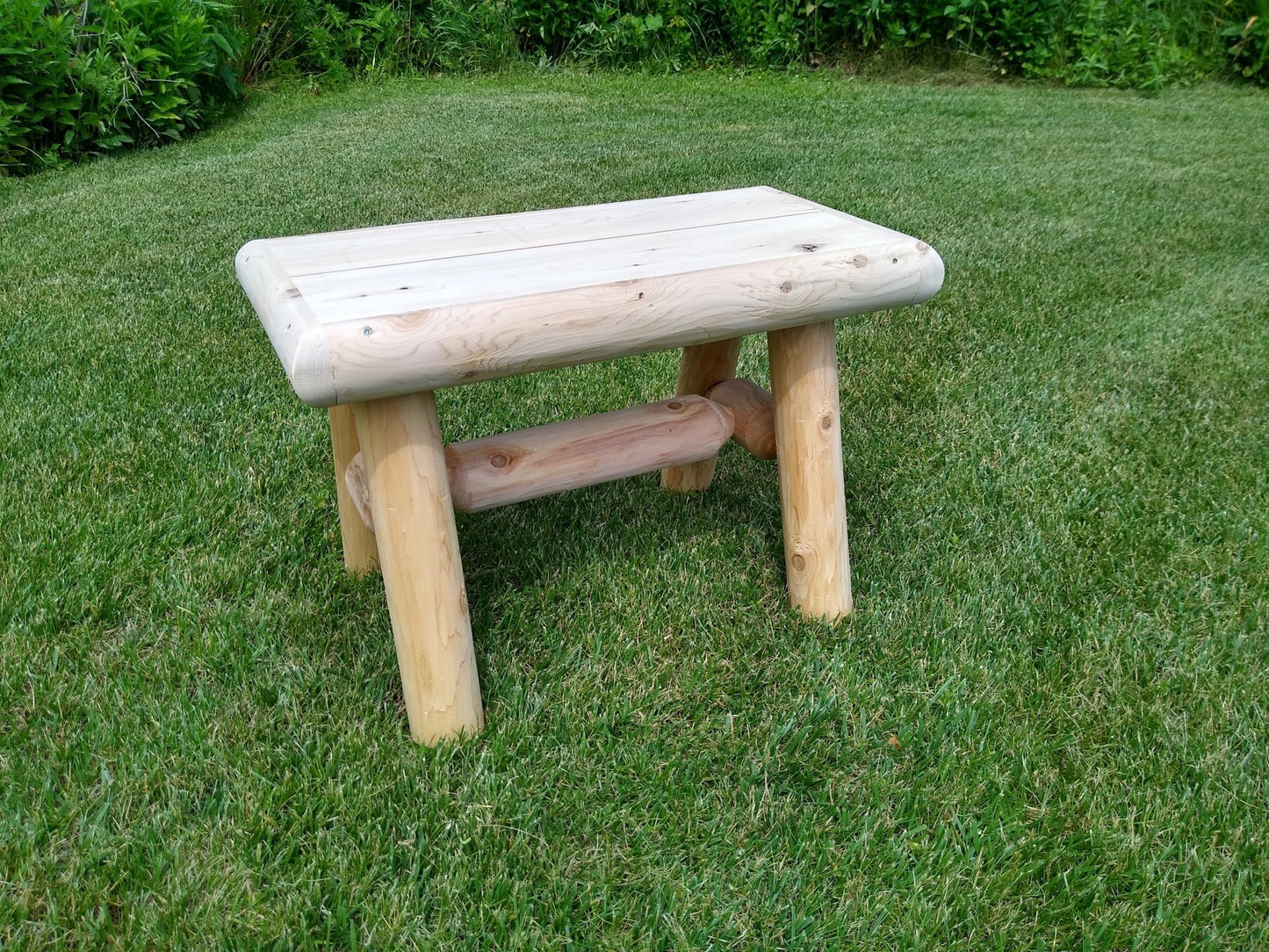 Rustic wooden outdoor garden bench by Cedar Creek Rustic Furniture, durable outdoor seating with natural wood finish.