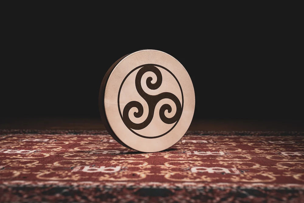 16-inch Triskele hand drum from Utah Energy Healing Center, featuring intricate design and natural wood finish.