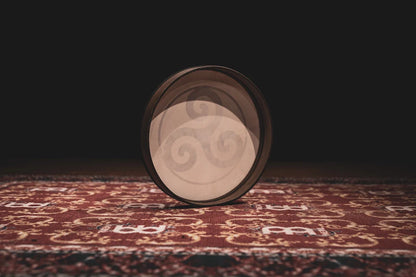 16-inch hand drum with triskele design from Utah Energy Healing Center, featuring a natural wood finish and intricate patterns.