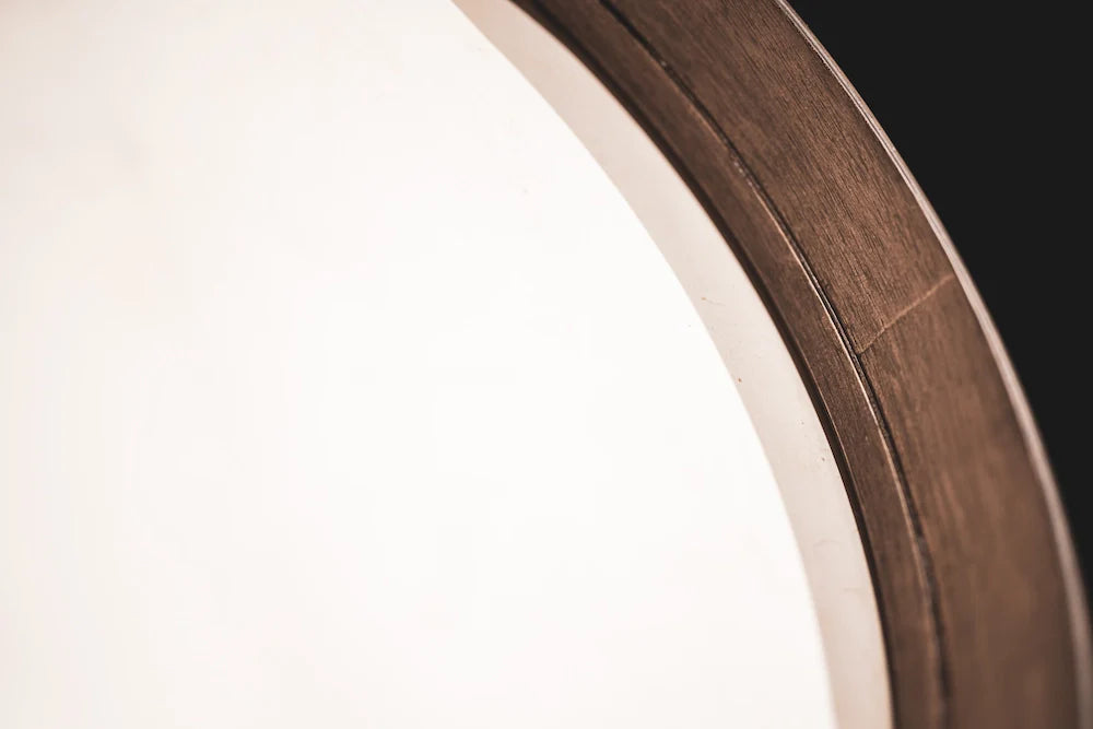 16-inch Triskele hand drum by Utah Energy Healing Center, featuring a natural wood finish and intricate triskele design, suitable for meditation.