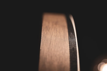 18-inch walnut brown hand drum from Utah Energy Healing Center, showing its textured surface and natural wooden finish.
