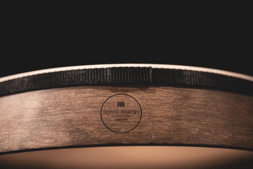 18-inch walnut brown hand drum from Utah Energy Healing Center, showing the textured wooden surface and natural drum shape.