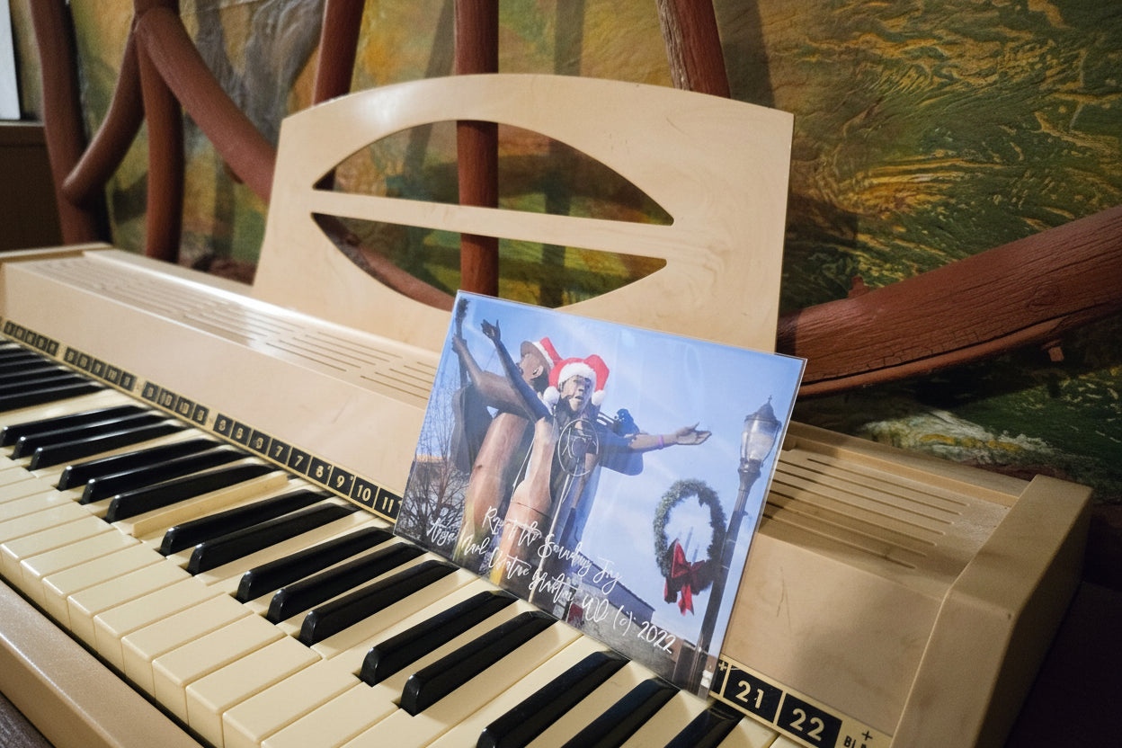 Vinyl record with cover featuring a couple and wreath on a piano