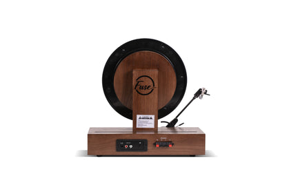 Fuse Audio GLD vertical vinyl record player turntable with a sleek design and visible tonearm on a wooden surface.