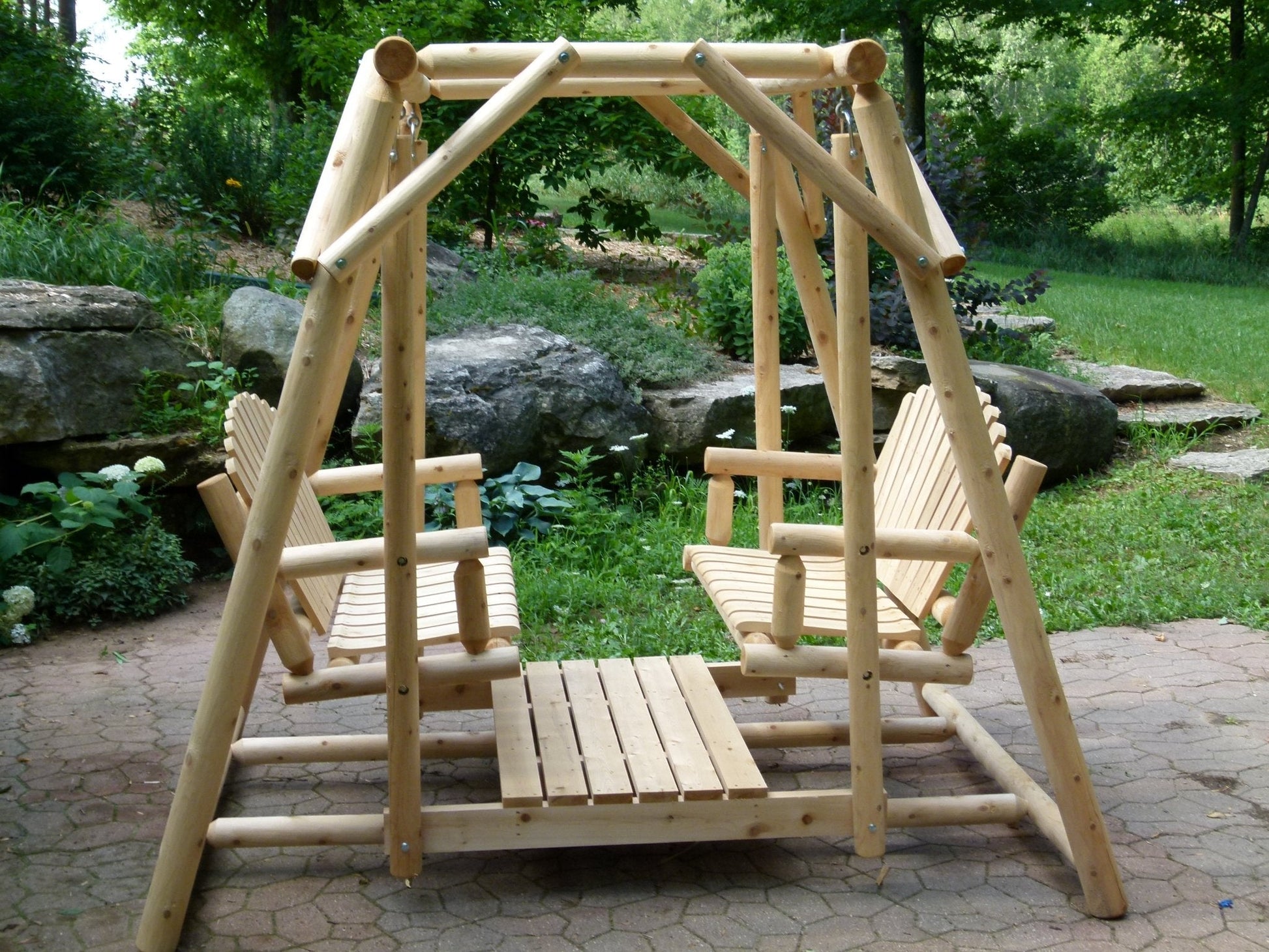 Double outdoor patio swing bench by Cedar Creek Rustic Furniture, featuring a wooden frame and comfortable seating for two.