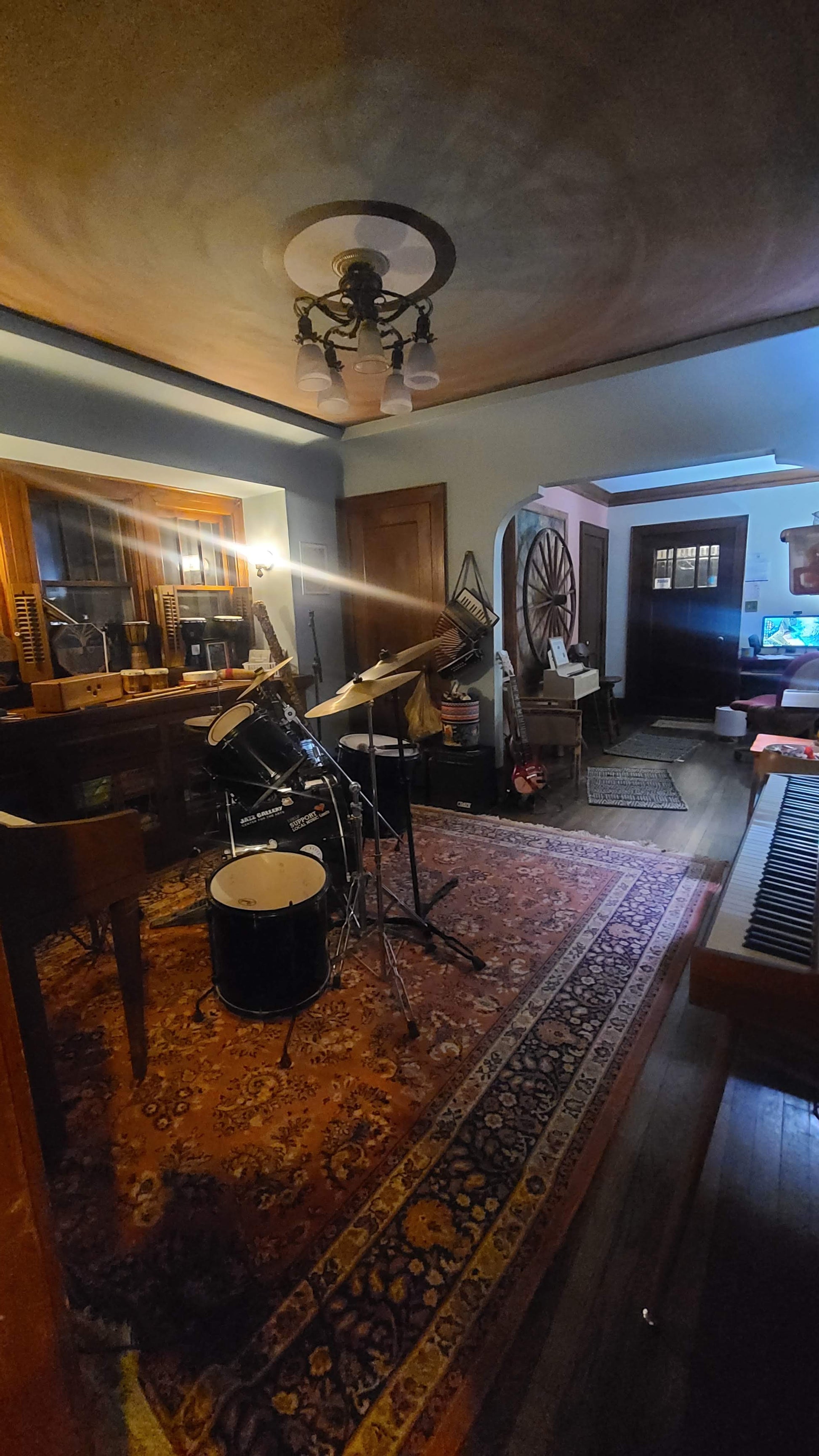 Music rehearsal space for rent by Ozaukee Talent Registrations, featuring a soundproof room with musical instruments and equipment.