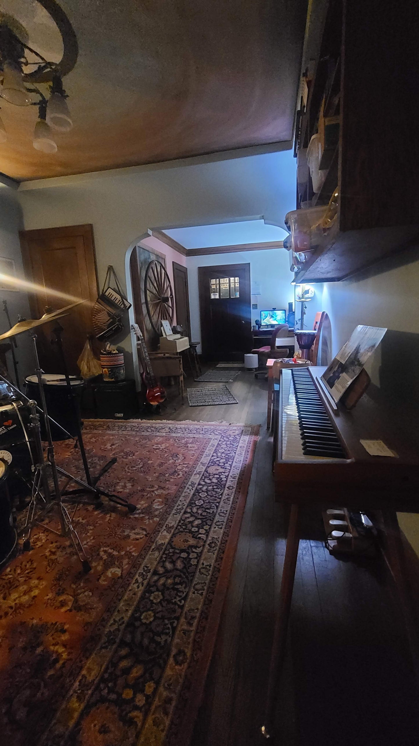 Music rehearsal space by Ozaukee Talent Registrations with soundproofed room, musical instruments, and professional recording equipment.