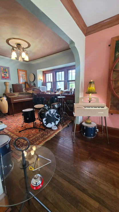 Music rehearsal space from Ozaukee Talent Registrations with soundproof room, musical instruments, and ample space for bands or solo practice.