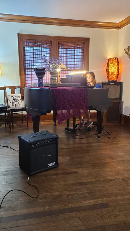 Music rehearsal space for rent by Ozaukee Talent Registrations, showing a soundproof room with musical instruments and equipment.