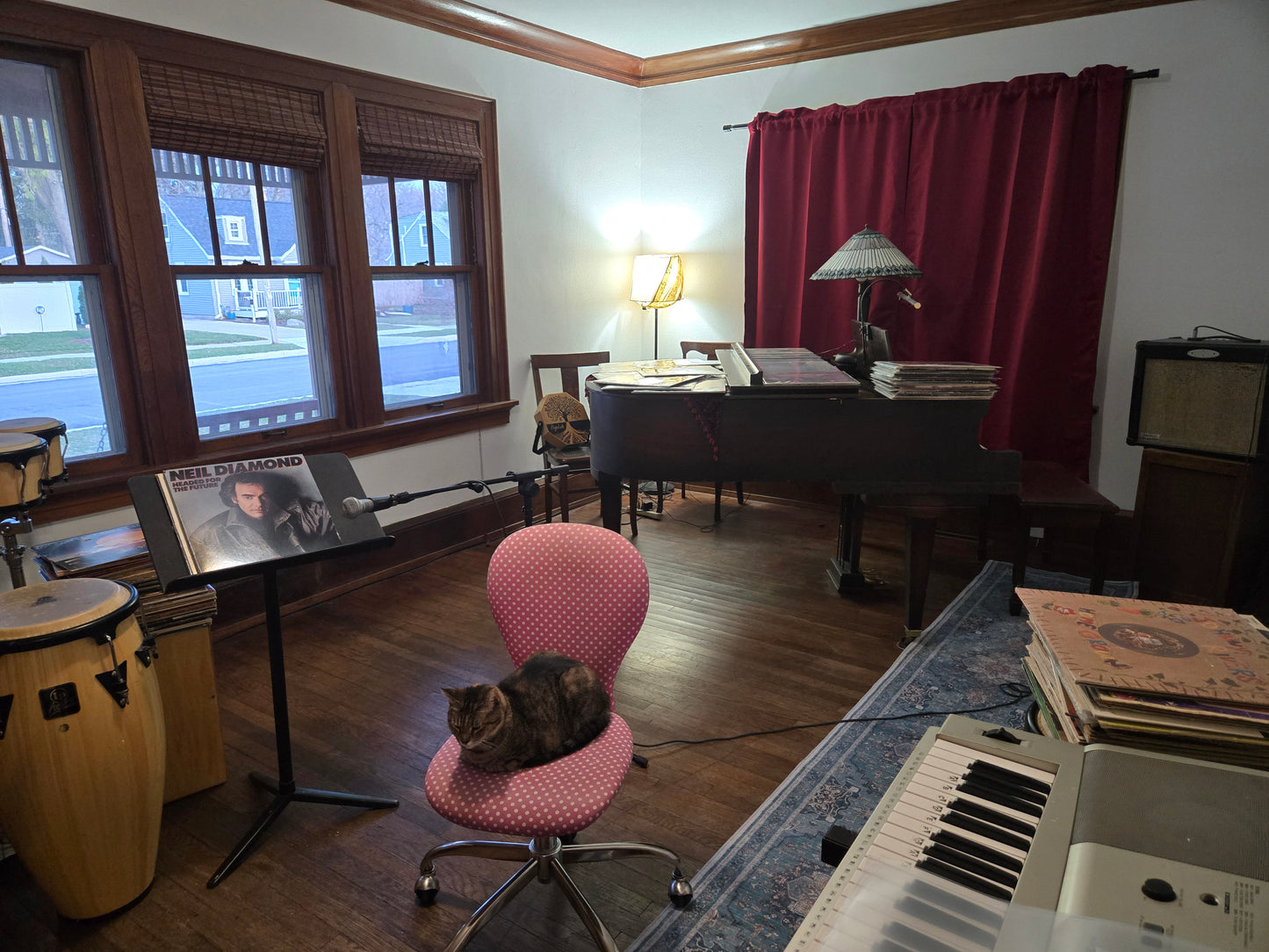 Music rehearsal space for rent by Ozaukee Talent Registrations, showing a soundproof room with musical instruments and sound equipment.