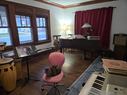 Music rehearsal space for rent by Ozaukee Talent Registrations, showing a soundproof room with musical instruments and sound equipment.