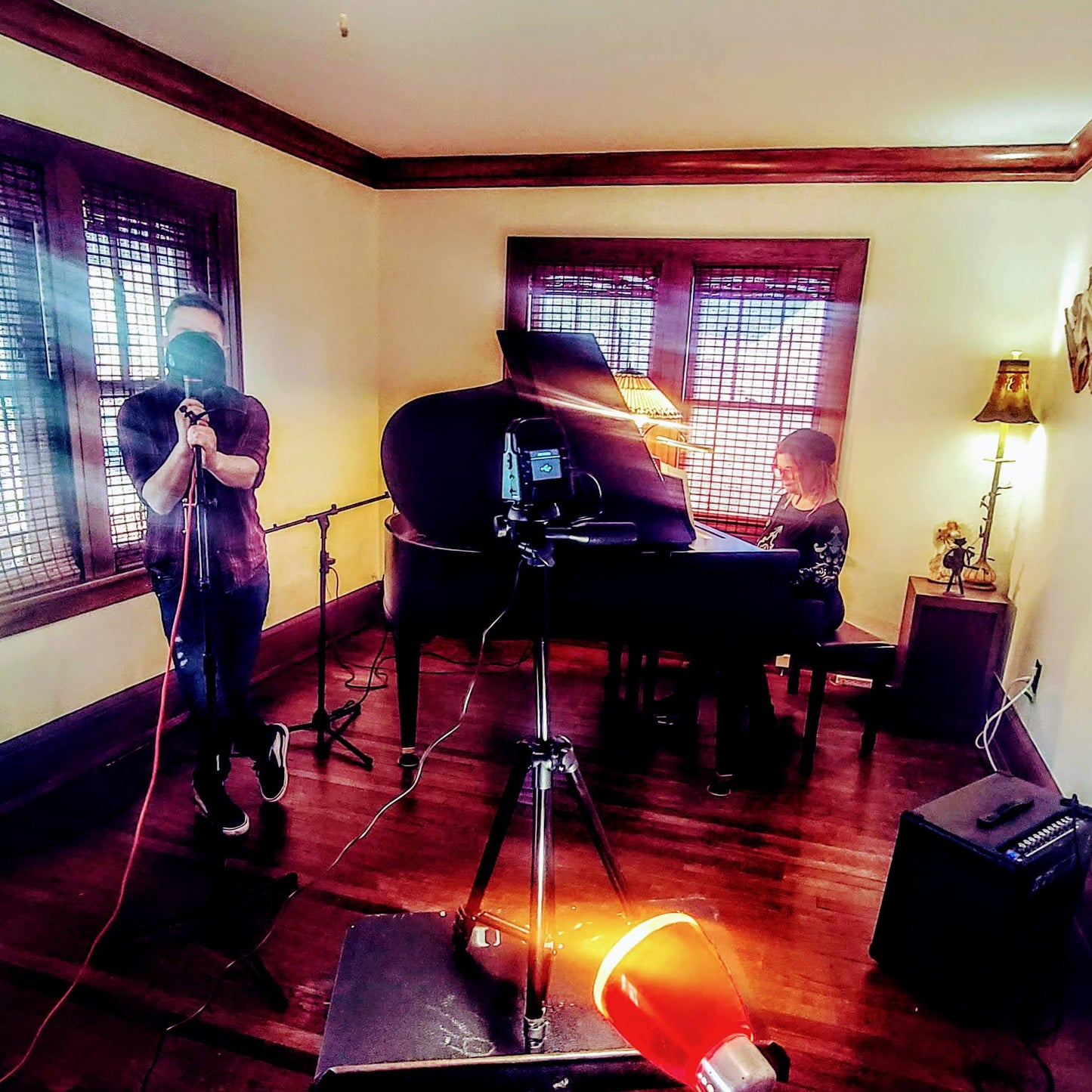 Music rehearsal space from Ozaukee Talent Registrations, showing a soundproof room with musical instruments and seating for musicians.