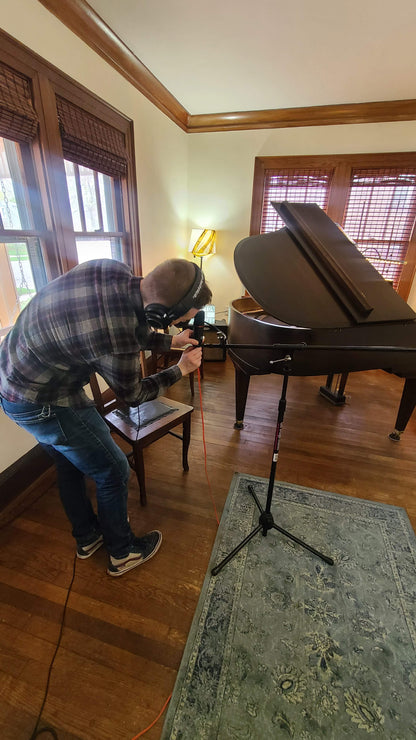Music rehearsal space from Ozaukee Talent Registrations, showing a soundproof room with musical instruments and acoustic panels.