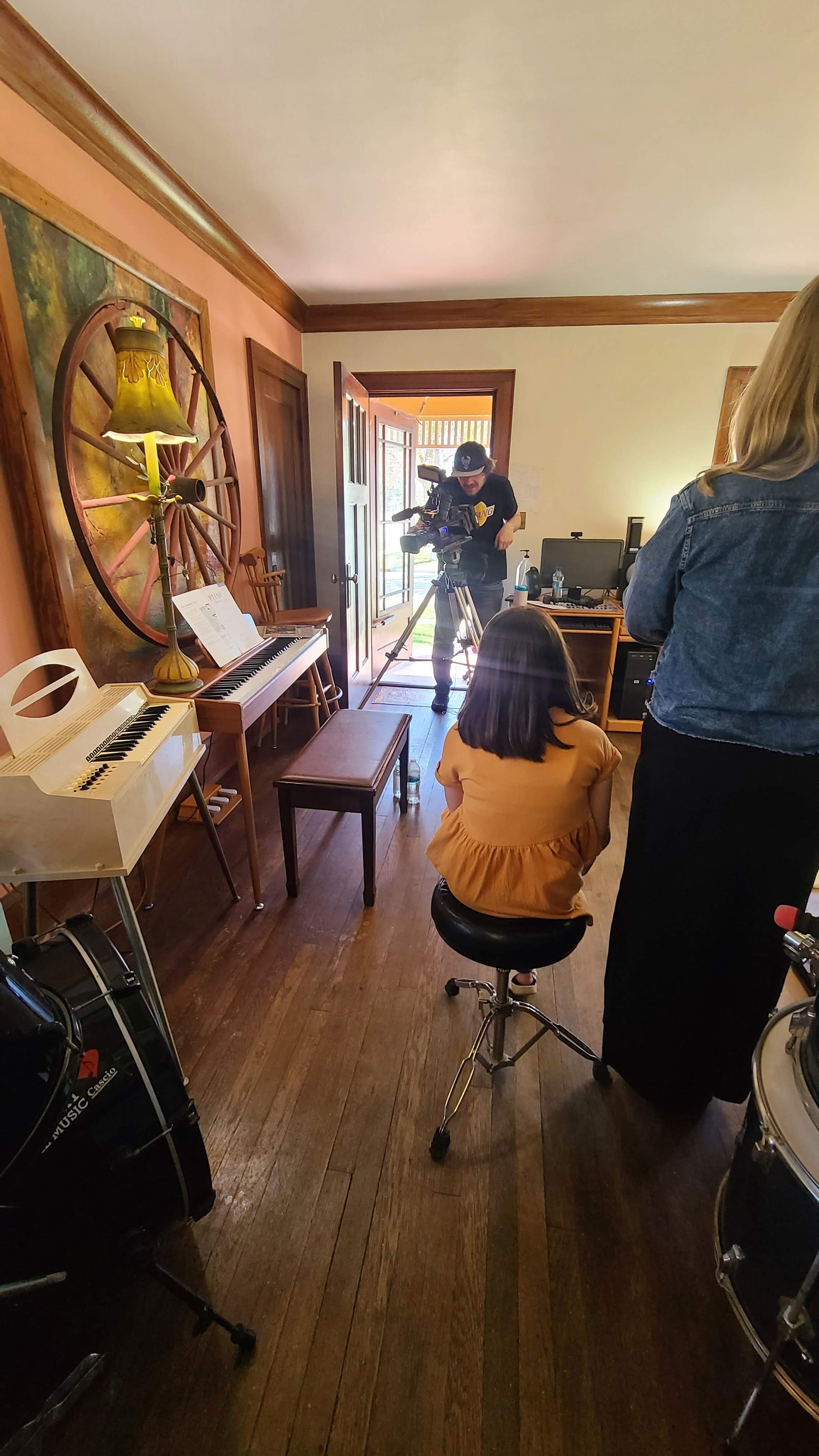 Music rehearsal space for rent by Ozaukee Talent Registrations, showing a soundproof room with musical instruments and recording equipment.